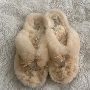 Ugg fluffy flip flops size 7, cream colored